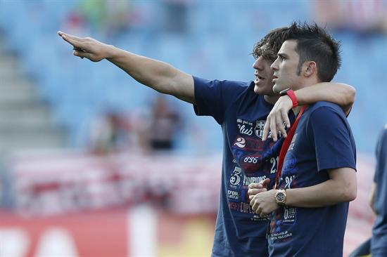 Los jugadores del FC Barcelona Carles Puyol (i) y David Villa. Foto: EFE