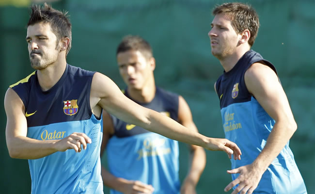 Los jugadores del FC Barcelona el argentino Leo Messi (d), el holandés Ibrahim Afellay (c) y David Villa. Foto: EFE