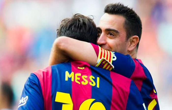 Xavi Hernández y Lionel Messi. Foto: AFP