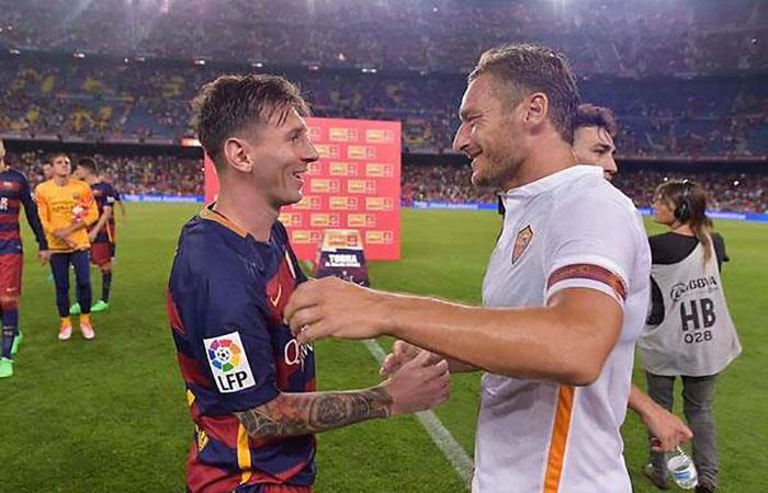 Lionel Messi y Francesco Totti. (AFP). Foto: AFP
